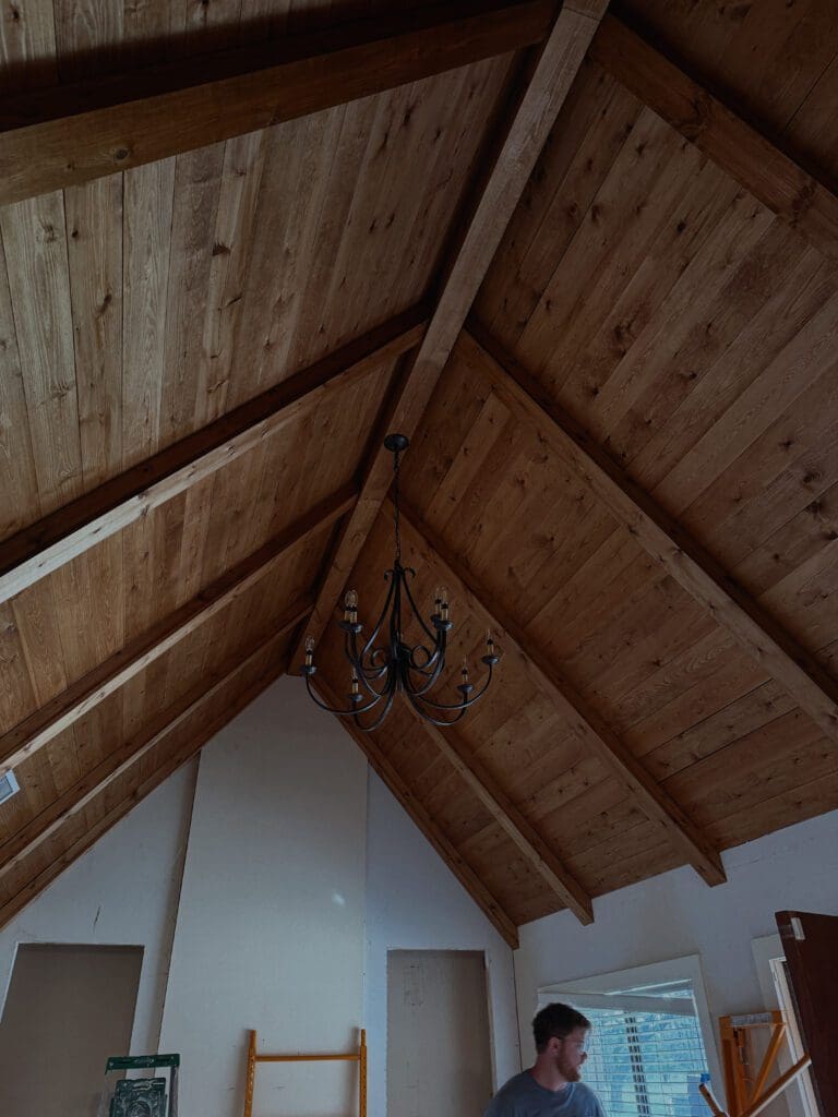 Natural wood vaulted ceiling with exposed beams biophilic design Texas Hill Country