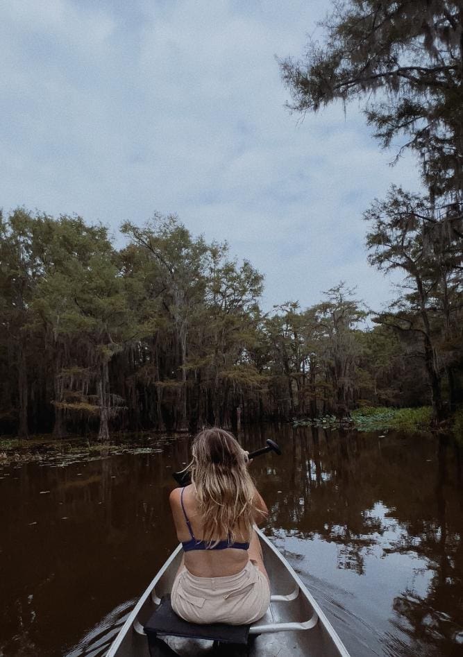 canoeing through cypress forest Caddo Lake State Park East Texas