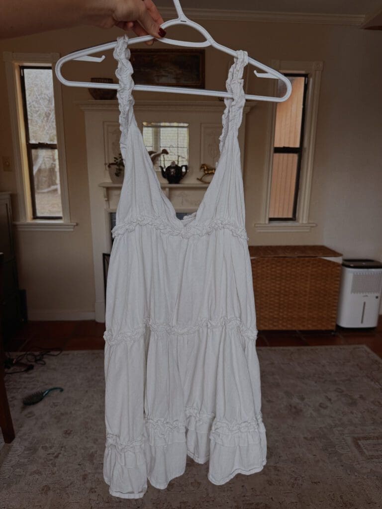 White tiered prairie dress thrifted western fashion cowboy boots styling 2026