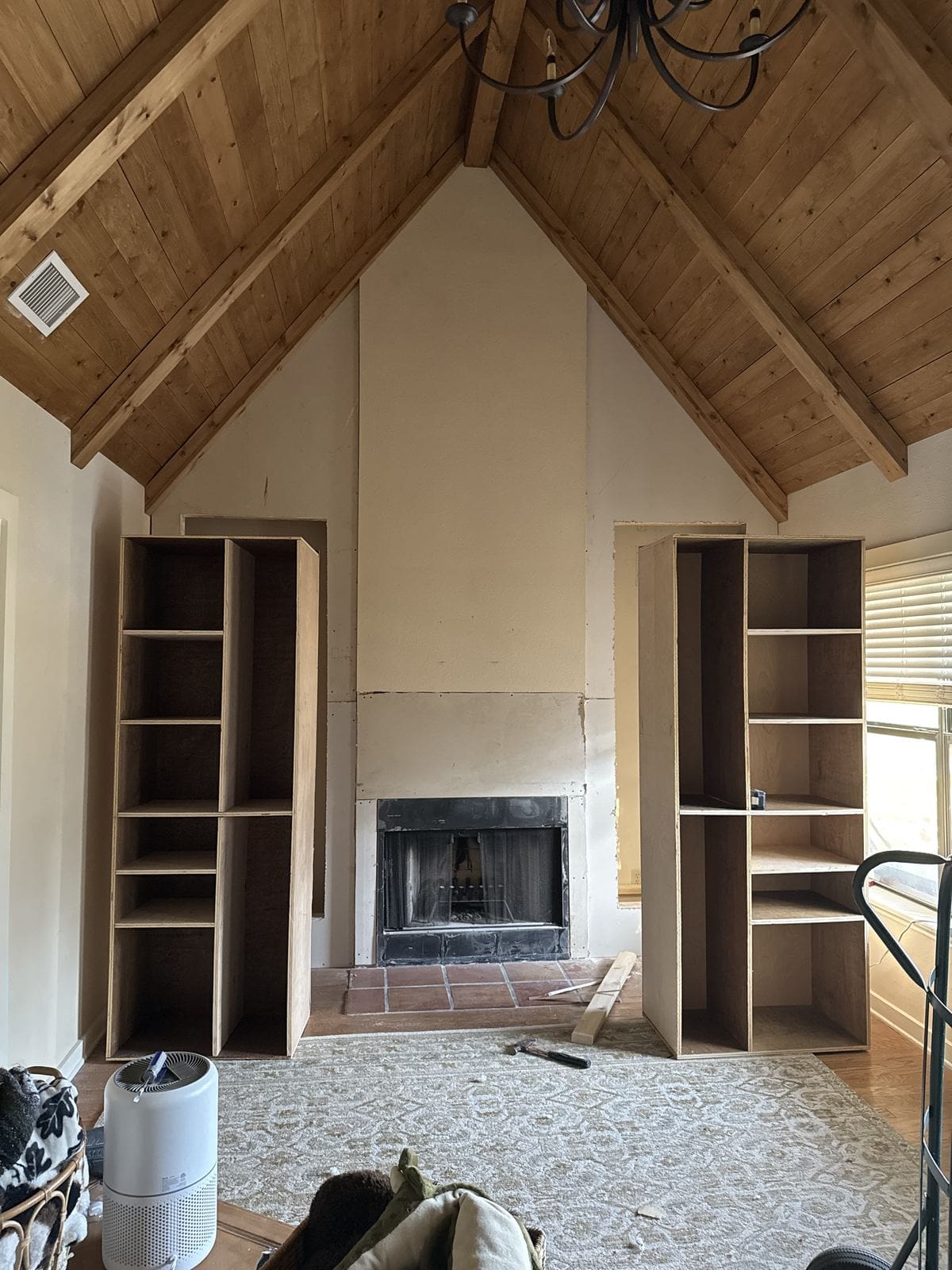 Birch built-in bookshelves installed on both sides of the fireplace before styling.