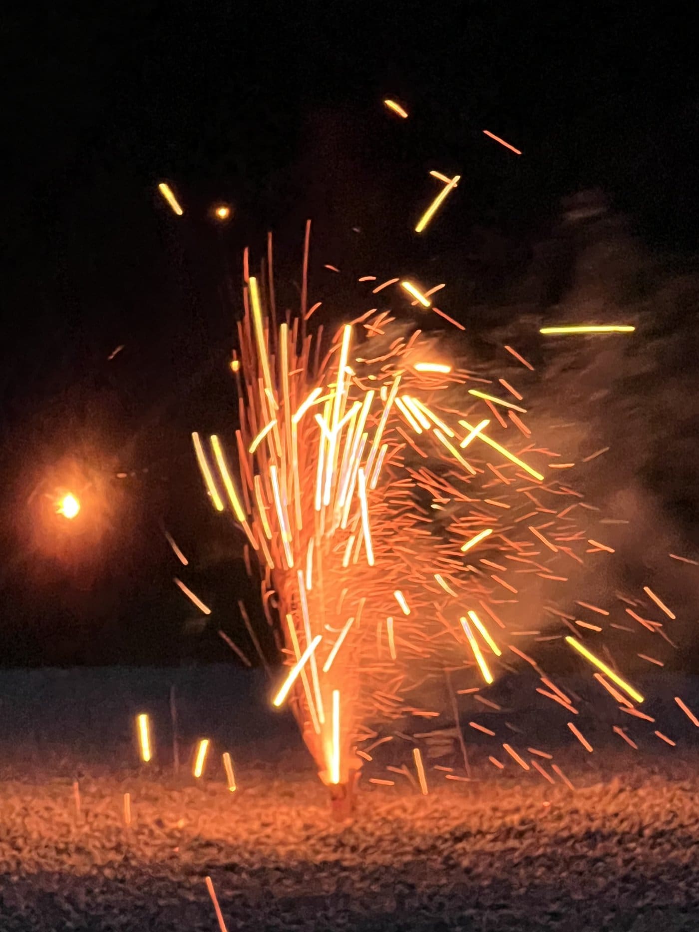 Fireworks sparks at dusk in the Texas Hill Country
