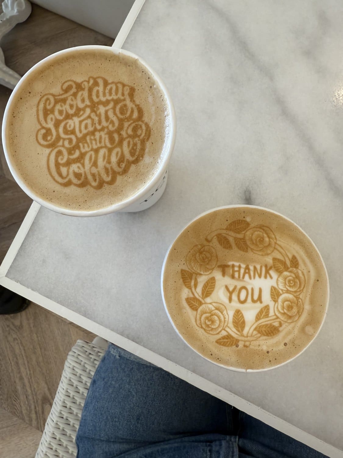 Two lattes with decorative latte art at Pookie