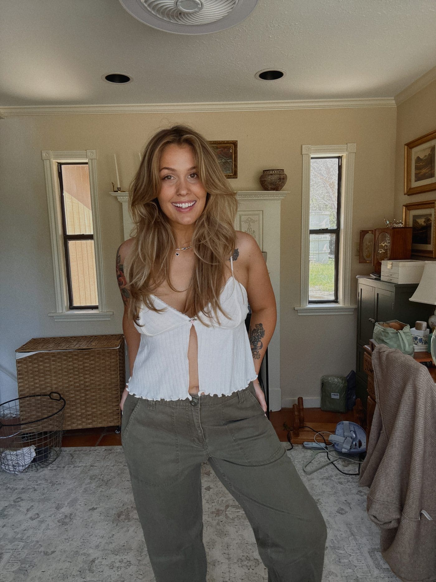 White tie-front cami styled with green pants